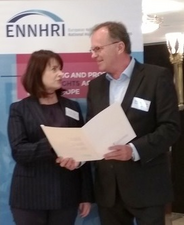 IOI Secretary General Kräuter congratulates Emily Logan on her new position