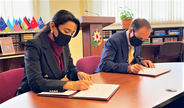 Commissioner for Human Righths Sabina Aliyeva and UNICEF Representative Edward Carwardine sign the Rolling Working Plan