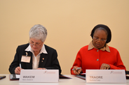 Dame Beverly A. Wakem, IOI President and Chief Ombudsman of New Zealand, and Alima D. Traore, AOMA First Vice President and Médiateur du Faso, signing the MoU.